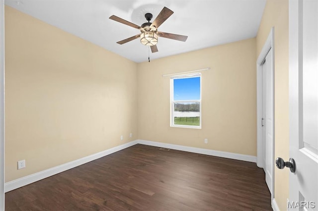2 Arthurs Ct, Troy, IL 62294 - unfurnished bedroom with baseboards, dark wood-style flooring, and a ceiling fan