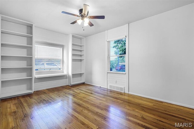 135 Hollyhock Ln, Edwardsville, IL 62025 - spare room featuring hardwood / wood-style floors, a ceiling fan, and baseboards