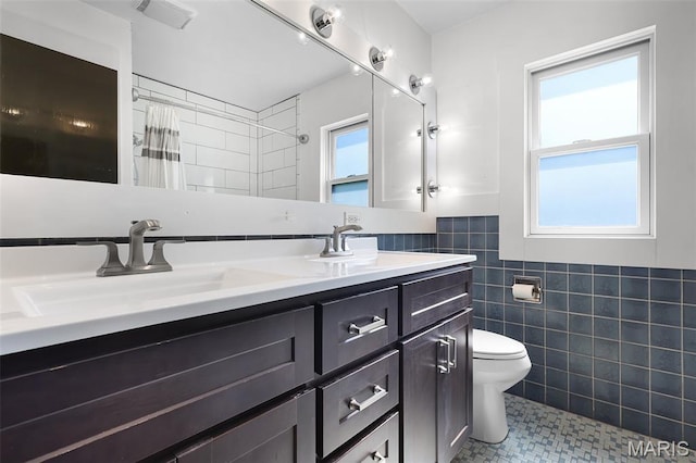 135 Hollyhock Ln, Edwardsville, IL 62025 - bathroom with tile walls, toilet, tile patterned floors, double vanity, and a shower with shower curtain
