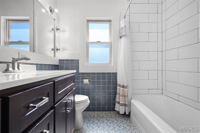 135 Hollyhock Ln, Edwardsville, IL 62025 - full bath with tile walls, plenty of natural light, toilet, wainscoting, and vanity