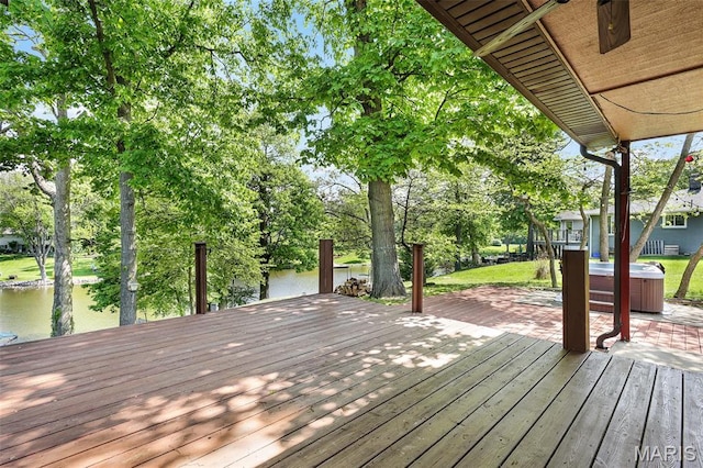 135 Hollyhock Ln, Edwardsville, IL 62025 - deck featuring a hot tub, a water view, view of wooded area, and a boat dock