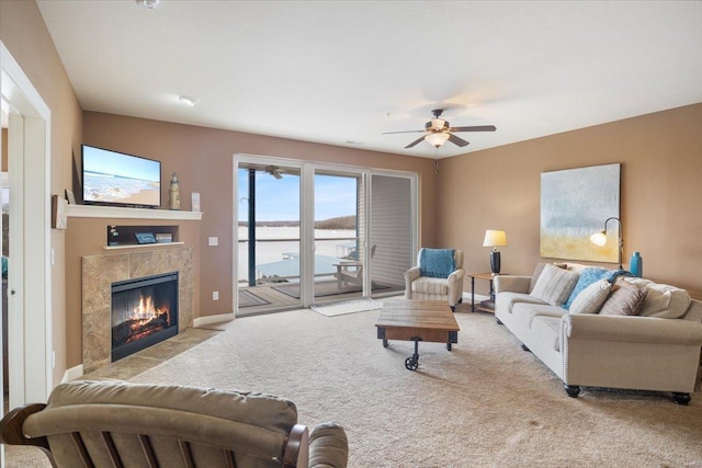 18011 Blue Anchor Dr Unit 132, Gravois Mills, MO 65037 - carpeted living room featuring a high end fireplace, ceiling fan, and baseboards