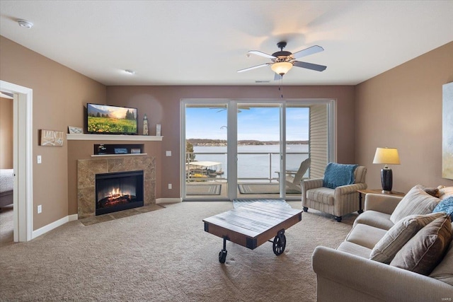 18011 Blue Anchor Dr Unit 132, Gravois Mills, MO 65037 - living room with carpet flooring, a premium fireplace, a ceiling fan, and baseboards