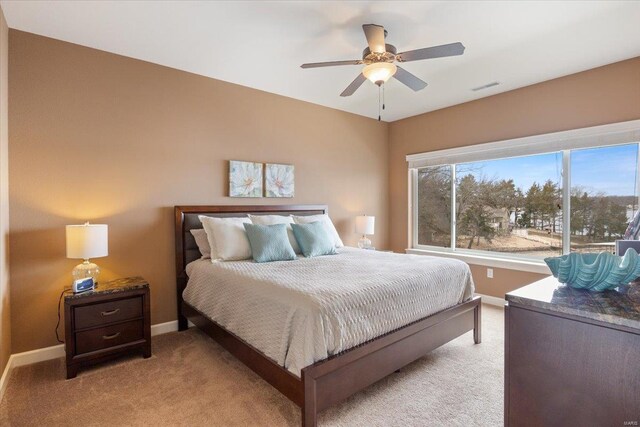18011 Blue Anchor Dr Unit 132, Gravois Mills, MO 65037 - bedroom featuring light colored carpet, baseboards, and a ceiling fan