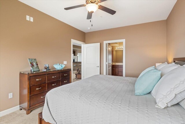 18011 Blue Anchor Dr Unit 132, Gravois Mills, MO 65037 - bedroom featuring light carpet, baseboards, ceiling fan, and connected bathroom