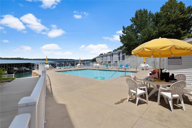 18011 Blue Anchor Dr Unit 132, Gravois Mills, MO 65037 - community pool featuring a patio and fence