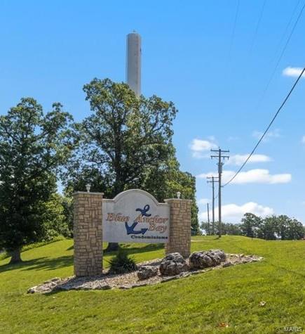 18011 Blue Anchor Dr Unit 132, Gravois Mills, MO 65037 - community sign with a lawn
