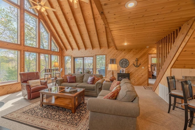2099 Meadow Valley Dr, Innsbrook, MO 63390 - living room with carpet flooring, wooden ceiling, high vaulted ceiling, wood walls, and a ceiling fan