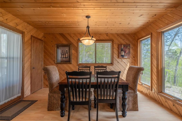 2099 Meadow Valley Dr, Innsbrook, MO 63390 - dining room featuring wooden walls, light wood-type flooring, and wooden ceiling
