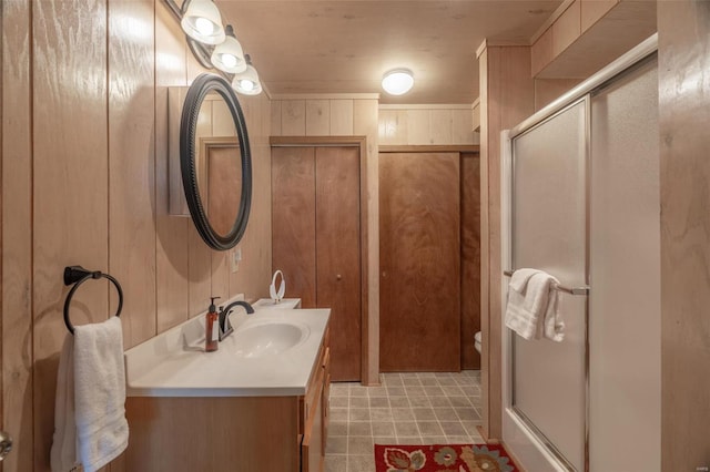 2099 Meadow Valley Dr, Innsbrook, MO 63390 - bathroom with a shower stall, vanity, toilet, and wood walls