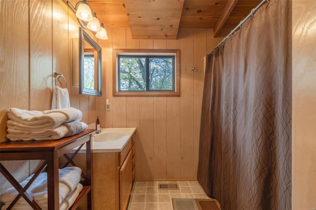 2099 Meadow Valley Dr, Innsbrook, MO 63390 - full bathroom featuring wood ceiling, vanity, wooden walls, and a shower with shower curtain