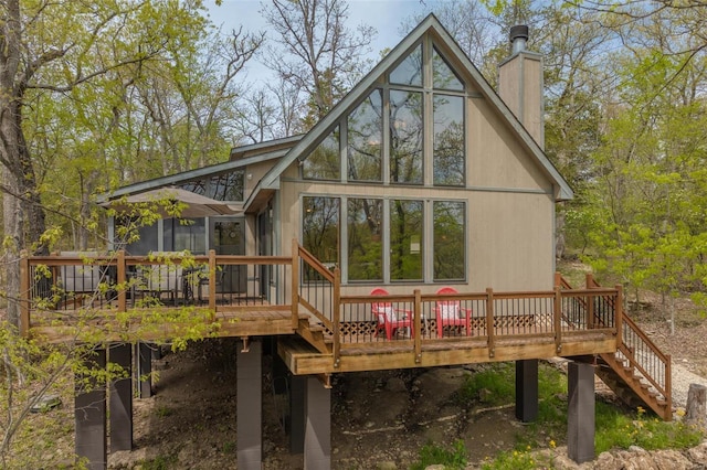 2099 Meadow Valley Dr, Innsbrook, MO 63390 - back of property featuring a deck, stairway, and a chimney