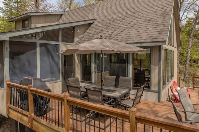 2099 Meadow Valley Dr, Innsbrook, MO 63390 - wooden terrace with outdoor dining area and a sunroom
