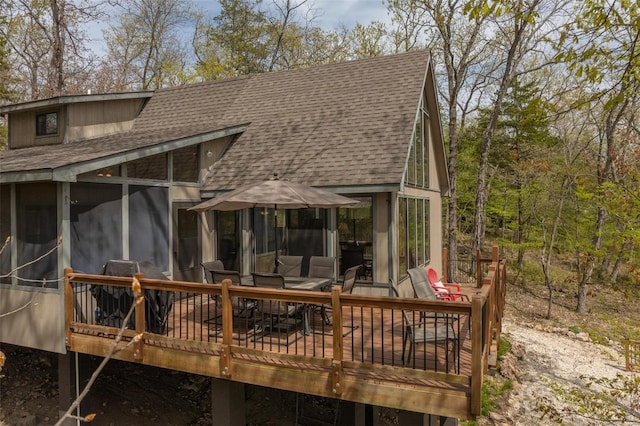 2099 Meadow Valley Dr, Innsbrook, MO 63390 - back of property featuring roof with shingles, a sunroom, and a deck