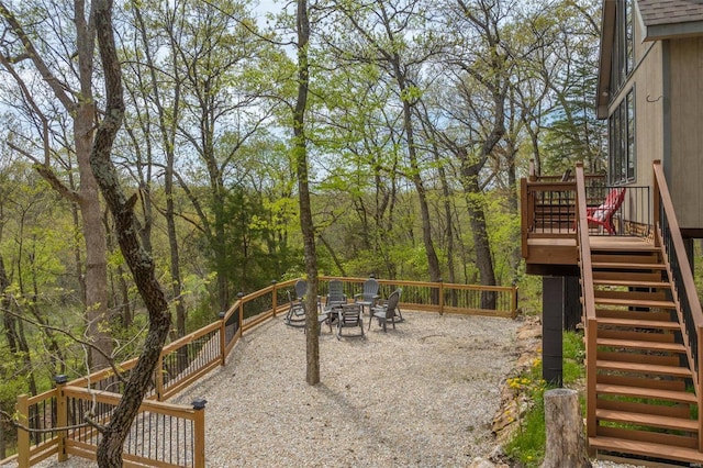 2099 Meadow Valley Dr, Innsbrook, MO 63390 - view of jungle gym featuring stairs, a deck, and outdoor dining area