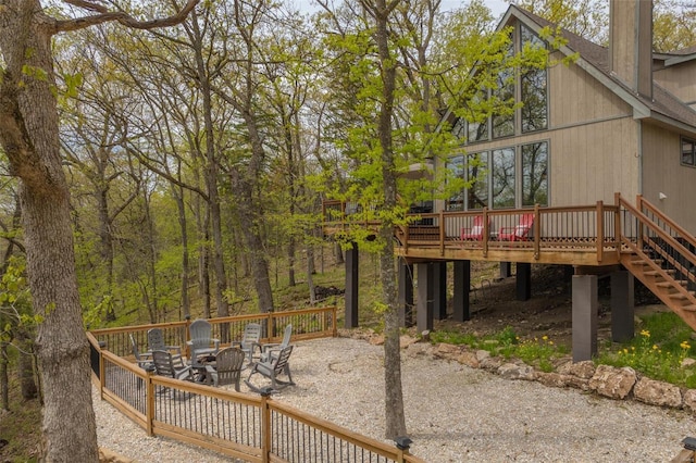 2099 Meadow Valley Dr, Innsbrook, MO 63390 - view of yard featuring a wooden deck, a fire pit, and stairway
