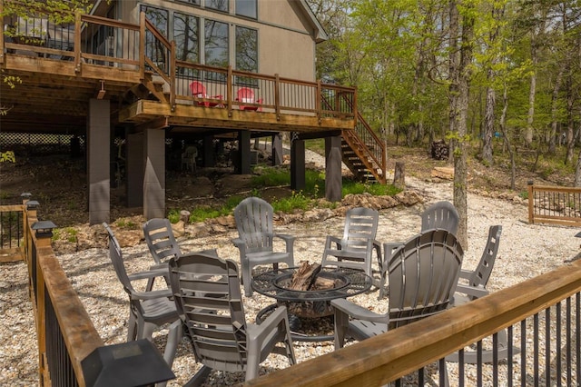 2099 Meadow Valley Dr, Innsbrook, MO 63390 - view of patio featuring a fire pit, stairs, and a wooden deck