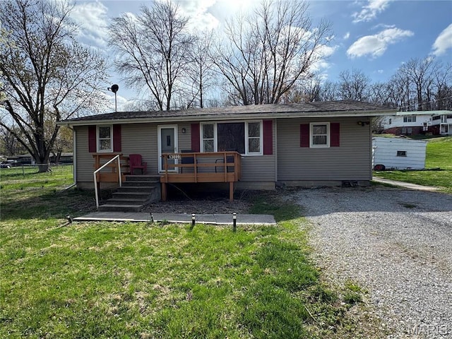 13899 Riverview Dr, New London, MO 63459 - view of front facade with a wooden deck and a front yard