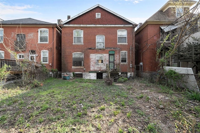 5169 Cates Ave, Saint Louis, MO 63108 - back of property with brick siding and fence