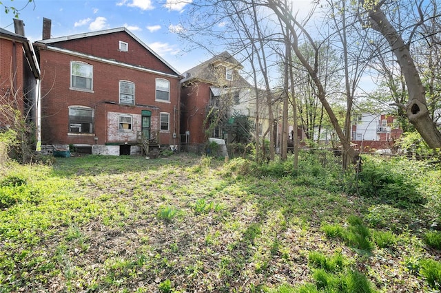 5169 Cates Ave, Saint Louis, MO 63108 - back of house with brick siding and fence