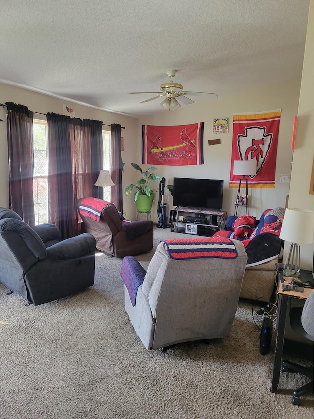 100 Grand Central Dr, Union, MO 63084 - carpeted living room featuring ceiling fan and a textured ceiling