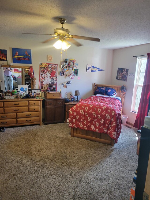 100 Grand Central Dr, Union, MO 63084 - bedroom featuring carpet floors, a textured ceiling, and a ceiling fan