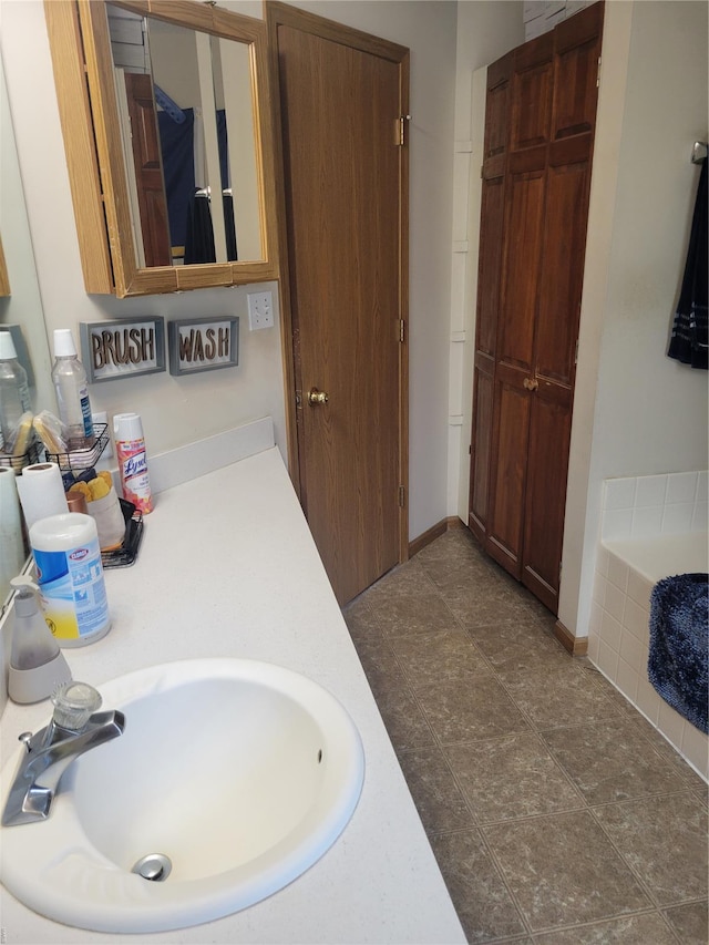100 Grand Central Dr, Union, MO 63084 - full bath featuring a sink and tiled bath