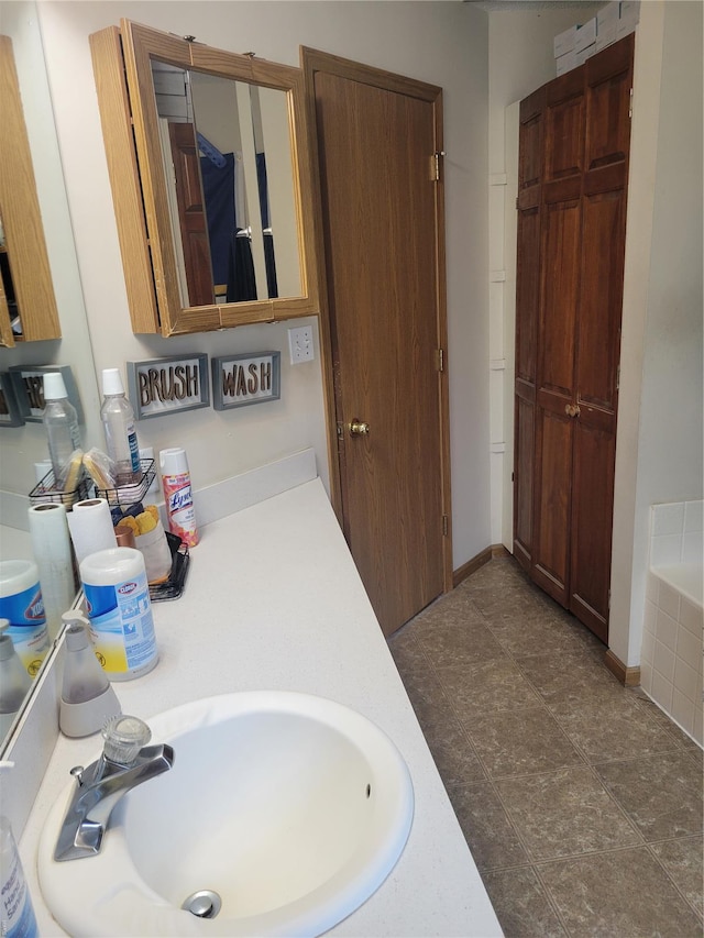 100 Grand Central Dr, Union, MO 63084 - bathroom featuring a sink and a relaxing tiled tub