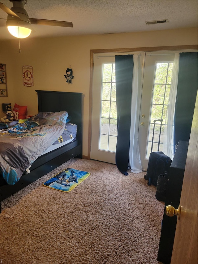 100 Grand Central Dr, Union, MO 63084 - bedroom with access to exterior, carpet, a textured ceiling, and a ceiling fan