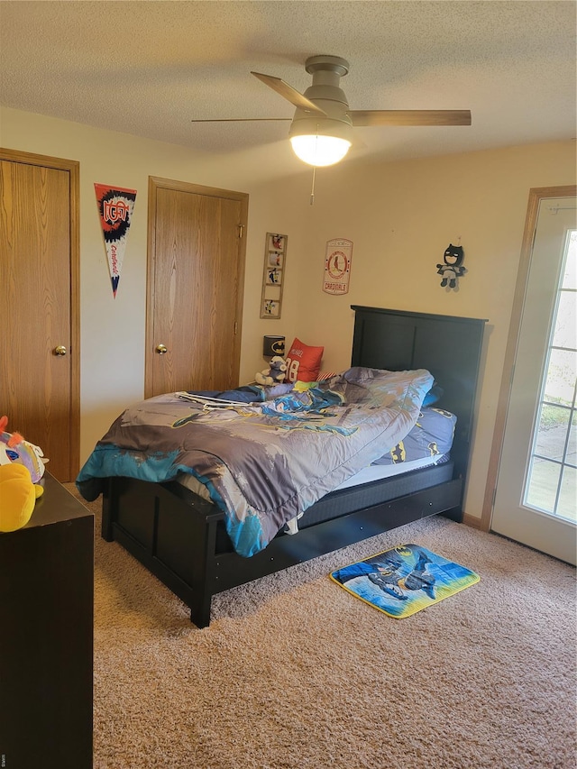 100 Grand Central Dr, Union, MO 63084 - carpeted bedroom featuring a textured ceiling and ceiling fan