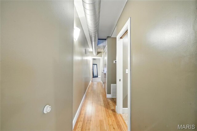 4228 Mcpherson Ave Unit 212, Saint Louis, MO 63108 - corridor with light wood-style flooring and baseboards