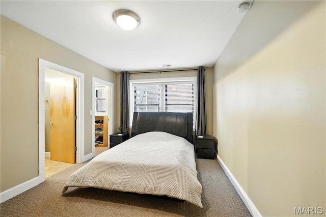 4228 Mcpherson Ave Unit 212, Saint Louis, MO 63108 - bedroom featuring light carpet and baseboards