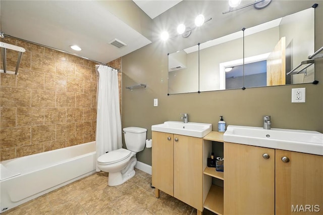 4228 Mcpherson Ave Unit 212, Saint Louis, MO 63108 - bathroom featuring vanity, toilet, shower / bath combo with shower curtain, and baseboards