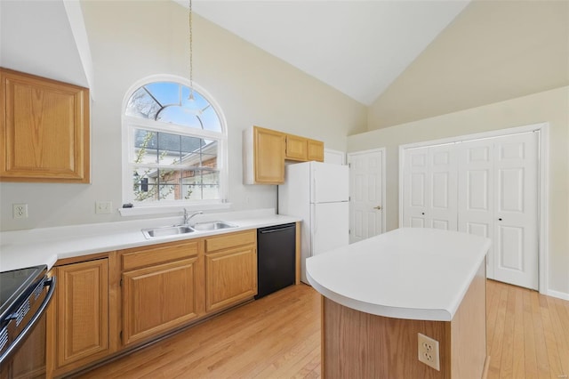 7426 Whitehall Colonial Ln, Saint Louis, MO 63119 - kitchen featuring a sink, black appliances, high vaulted ceiling, light wood-style flooring, and healthy amount of natural light