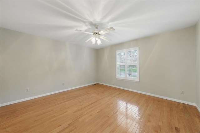 7426 Whitehall Colonial Ln, Saint Louis, MO 63119 - unfurnished room featuring light wood finished floors, baseboards, and a ceiling fan