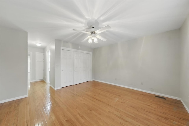 7426 Whitehall Colonial Ln, Saint Louis, MO 63119 - unfurnished bedroom with light wood-style floors, baseboards, a closet, and ceiling fan