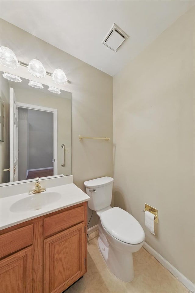 7426 Whitehall Colonial Ln, Saint Louis, MO 63119 - bathroom with baseboards, vanity, and toilet