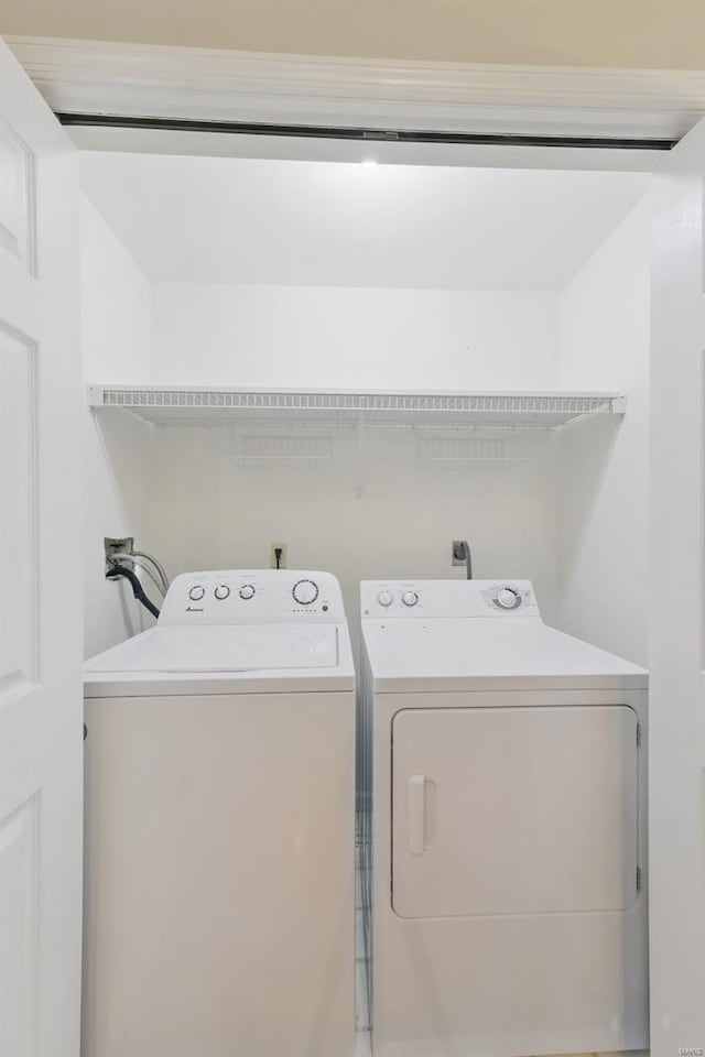 7426 Whitehall Colonial Ln, Saint Louis, MO 63119 - clothes washing area with independent washer and dryer