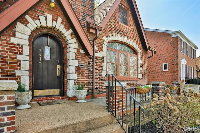 7414 Bruno Ave, Saint Louis, MO 63117 - view of exterior entry featuring brick siding and covered porch