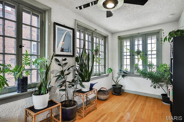 7414 Bruno Ave, Saint Louis, MO 63117 - living area with ceiling fan, healthy amount of natural light, french doors, a textured ceiling, and wood finished floors