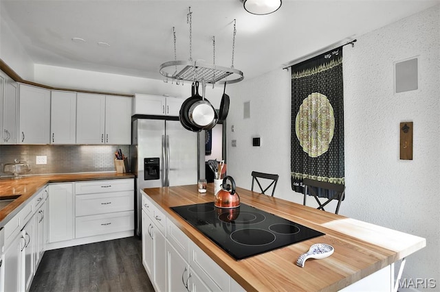 7414 Bruno Ave, Saint Louis, MO 63117 - kitchen with wood counters, stovetop, a textured wall, backsplash, and dark wood finished floors