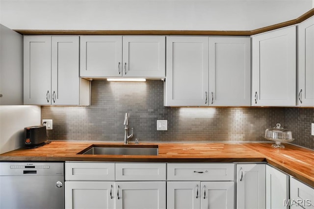 7414 Bruno Ave, Saint Louis, MO 63117 - kitchen with wooden counters, stainless steel dishwasher, a sink, and backsplash