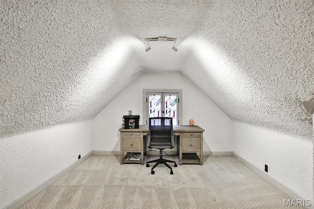 7414 Bruno Ave, Saint Louis, MO 63117 - carpeted office space featuring a textured ceiling, lofted ceiling, baseboards, and a textured wall
