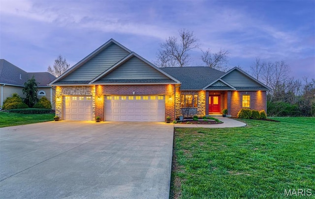 craftsman house with an attached garage, a front yard, brick siding, and concrete driveway
