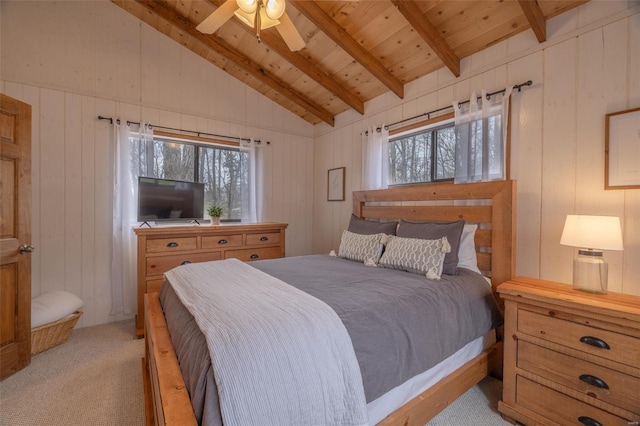 bedroom featuring light carpet, multiple windows, wooden ceiling, wooden walls, and a ceiling fan