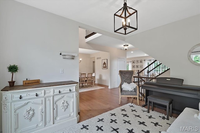 472 Cypress Creek Ln, Imperial, MO 63052 - entrance foyer featuring light wood-type flooring, a chandelier, stairway, and baseboards