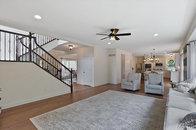 472 Cypress Creek Ln, Imperial, MO 63052 - living area with a chandelier, ceiling fan, wood finished floors, baseboards, and recessed lighting