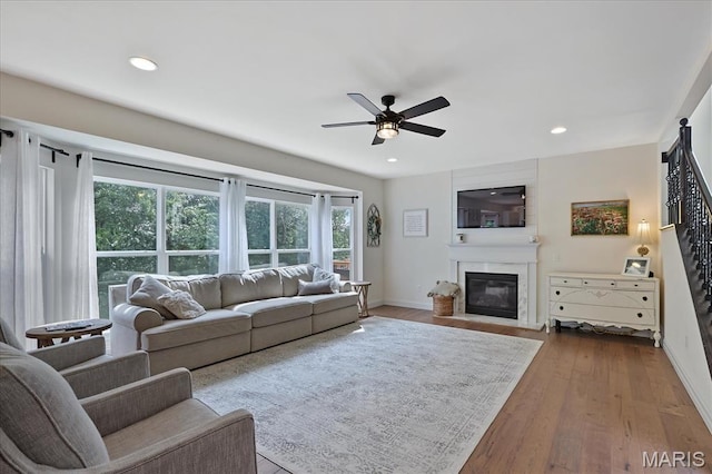 472 Cypress Creek Ln, Imperial, MO 63052 - living area featuring a large fireplace, ceiling fan, baseboards, wood finished floors, and recessed lighting