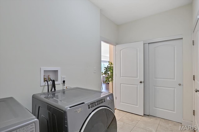 472 Cypress Creek Ln, Imperial, MO 63052 - washroom featuring washer and dryer and light tile patterned floors