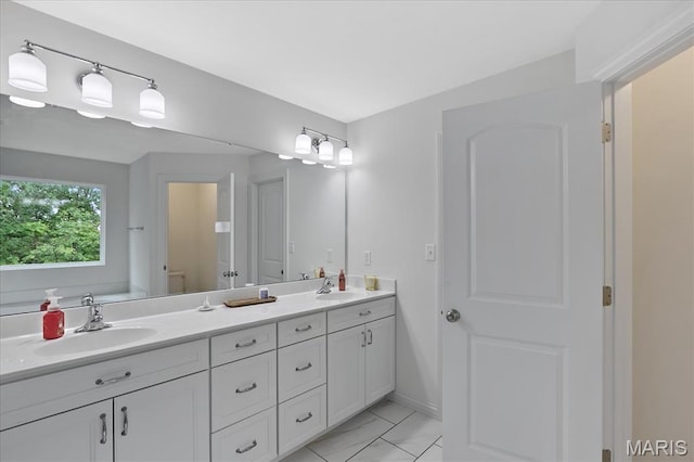 472 Cypress Creek Ln, Imperial, MO 63052 - bathroom featuring double vanity and marble finish floors